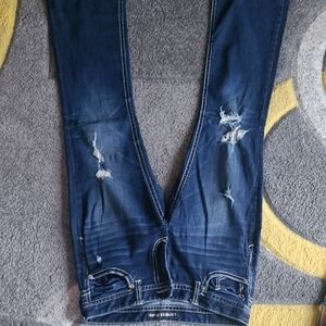 Distressed Blue Jeans